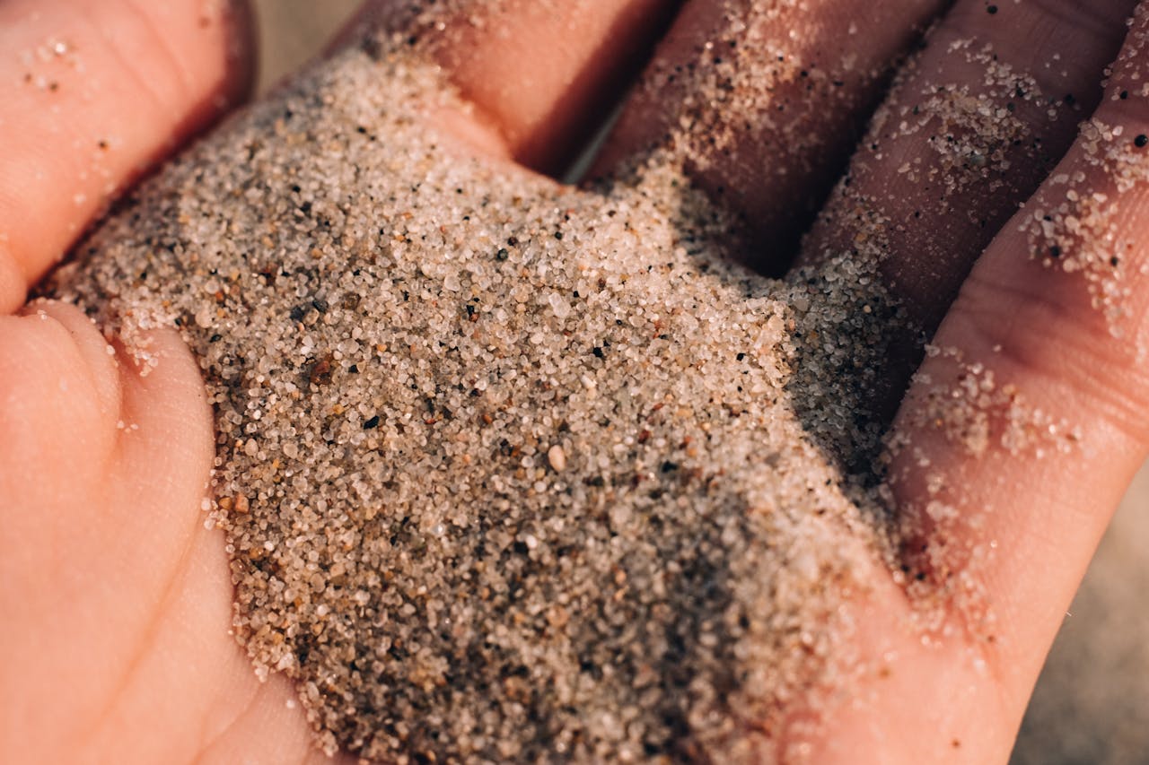 The Art of Drawing Readers In: Your attractive post title goes here Detailed close-up of sand slipping through fingers on a warm sunny day.
